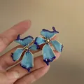 Close-up detail of elegant blue enamel flower earrings being held to show fine craftsmanship - Blue-Purple Gradient Flower Style (11#) / Gold / Blue