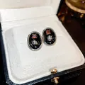Elegant black enamel oval stud earrings featuring red gemstone and silver flower - 39# Black Color with Silver Pin