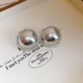 Elegant round silver stud earrings with sparkling rhinestone halo for a sophisticated look. - 20# Silver Earring Post-Silver