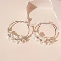 Silver hoop earrings adorned with delicate white glass flowers and small silver beads. - 23# Earring - Silver