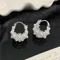 Elegant silver needle hoop earrings decorated with delicate white pearl floral clusters - Pearl Hoop Style / Silver