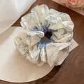 Elegant blue floral mesh scrunchie hair tie with delicate lace details on wooden tray - Mesh Floral Lace Style (47#)