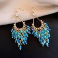 Elegant gold-tone tassel earrings featuring vibrant blue glass beads and leaf motifs - 50# Ear Hooks - Gold - Blue