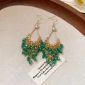 Elegant vintage-style dangling earrings featuring green glass beads and gold finish detail. - 52# Ear Hook - Gold - Green