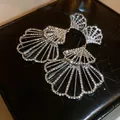 Close-up of luxury sparkling rhinestone fan-shaped earrings on black leather. - Fan Shaped Pendant Style (3#)
