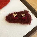 Close-up detail view of red flocked cherry hair clips featuring golden twisted bow accents - Duckbill Hair Clips / One Pair / Red Flocking Butterfly Cherry