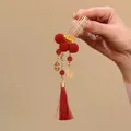 Detailed view of traditional Chinese red hair comb with gold ingot and elegant tassel - Hair Stick / 1 Piece / Gold Ingot Red Fur Ball