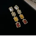 Close-up of vintage gold-tone drop earrings with rectangular amber and red crystals - Four Layer Gradient Rectangular Earrings / Silver Earring Post Style / Gold-Multicolor