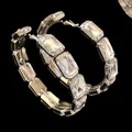 Close-up of sparkling rectangular crystal facets on oversized silver hoop earrings - Oversized Hoop Earrings (HE23822) / Silver