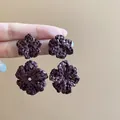 Detail showing the intricate rattan woven texture of these brown flower drop earrings. - 43# Brown