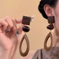 Bohemian geometric wooden teardrop earrings for beach vacations, worn by model. - 7# Coffee Color