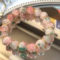 Handgefertigtes Armband mit rosa und grünen Blumenperlen und goldenen Elementen im Shop - 72# Armband-gemischte Farben-runde Perlen