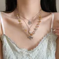 Close-up of layered vintage necklace with moon, tree of life, and dragonfly charms - Style 2-Tree Of Life Pendant