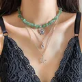 Detailed view of layered necklace featuring green stones with sun, moon, and star pendants. - Style 7-Sun Star Moon Pendant