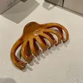 Stylish amber-colored wave hair claw clip designed for elegant Korean updo hairstyles. - Amber Color Amber Texture