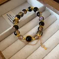 Handcrafted ethnic style crystal beaded bracelet with gold accents and hanging chain - Style 46 / Black-Gold