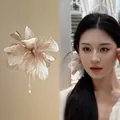 Elegant fabric flower hair pin with pearl tassel for ethereal wedding styling. - Elegant Fabric Flower Style / Brown