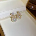 Elegant heart stud earrings with crystal bow and iridescent pearl drops in gold tone - Heart Bowknot Style (HE13865) / Gold