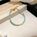 Ethnic style blue crystal beaded bracelet with white pearls and gold accents - Style 102 Bracelet / Blue & White