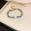 Elegant blue crystal beaded bracelet with a baroque pearl and gold extender chain - Style 106 Bracelet / Blue & White