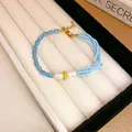 Handmade ethnic style blue crystal beaded bracelet featuring white pearls and gold accents - Pearl and Hollow Metal Bead Style (77#) / Blue