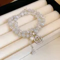 Elegant double-strand crystal beaded bracelet with camellia charm and pearl on tray - Style 127 Bracelet / White