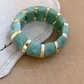 Fashionable green marbled acrylic stretch bracelet with gold-toned metal spacers - Green Marble