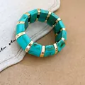Bohemian turquoise marbled acrylic stretch bracelet with polished gold-tone metal spacers - Dark Green Texture