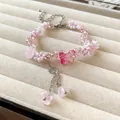 Elegant handmade pink crystal beaded bracelet featuring butterfly and floral pendants - Butterfly Flower Tassel Style (159) / Pink