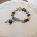 Handcrafted ethnic style beaded bracelet with silver elephant peanut charms and crystal beads - Vintage Silver Elephant Peanut Style (184) / Red/Khaki