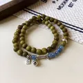Ethnic style double-layer green wood bead bracelet with blue crystals and silver charms - Double Wrap Fish Pendant Style (203) / One Size / Blue-Silver