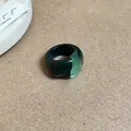 Detail shot of a vintage chunky resin ring with geometric bicolored green marbling. - 40# Green