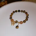 Elegantes Armband aus Tigerauge-Perlen mit goldenem Schmetterlingsanhänger und matten Akzenten - 50# Armband-kaffee-schmetterling