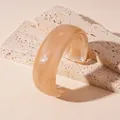 Elegant wide marble acrylic wavy bangle with beige swirled pattern for stylish women - Style 3
