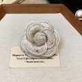 Elegant white tweed camellia flower brooch pin showing intricate fabric texture detail - Tweed Bud Style (WP159)