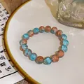 Handgefertigtes Armband aus Crackle-Glasperlen in Blau und Lachsrosa-Tönen - 74# Armband-blau-runde Perlen