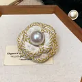 Close-up detail of a French-style camellia brooch with woven gold trim and a central pearl - Gold Wire Woven Style (WP160)