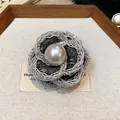 Elegant camellia brooch featuring silver woven petals and a lustrous center pearl detail - Metal Wire Woven Style