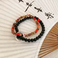 Elegantes handgefertigtes Perlenarmband für Freundinnen mit roten und schwarzen Steinen - 125# Armband - Schwarz