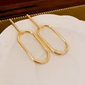 Boucles d'oreilles pendantes ovales géométriques dorées avec un design minimaliste chic - Ovale Géométrique (100#)