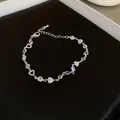 Adjustable silver heart and zircon bracelet with sparkling charms for women - Hollow Heart Zircon Style / Silver