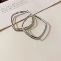 Minimalist silver geometric hoop earrings with a sleek polished finish - Silver