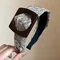 Vintage paisley pattern fabric headband featuring a stylish brown square wooden buckle - White