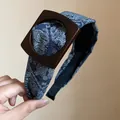 Elegant blue paisley fabric headband featuring a stylish square wooden buckle detail - Blue
