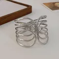 Detailed close-up view of a silver multi-layer criss-cross open cuff bracelet - Style 6-Multi-layer