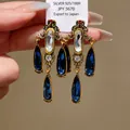 Vintage palace style drop earrings with blue water-drop crystals held on a display card - 925 Sterling Silver Earring Post (46)