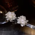 Elegant white pearly flower stud earrings with silver needles for a sweet minimalist look. - Style 11