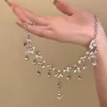 Detailed view of an elegant silver-tone zircon necklace with cascading teardrop pendants - Layered Tassel Style (2#) / Silver-Pink