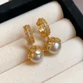 Close-up of French retro gold plated lace earrings with white pearls and zircons - Real Gold Plated Gold Style