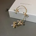 Elegant gold-tone ear cuff earring featuring sparkling crystal flowers and white pearls - Left Ear Rhinestone Flower Ear Hook (17) / Gold